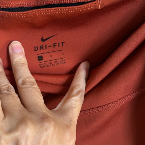 Nike leggings with side logo on the side leg size large NWOT. Burt/brick  color - Picture 3 of 5